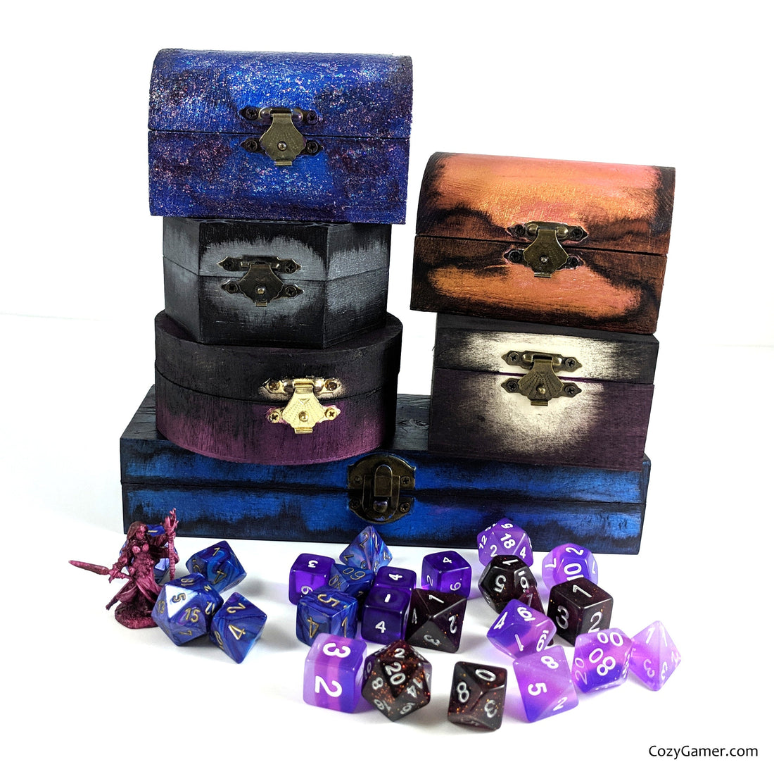 Hand-painted dice boxes with polyhedral dice sets from Cozy Gamer, enhancing tabletop RPG campaigns.
