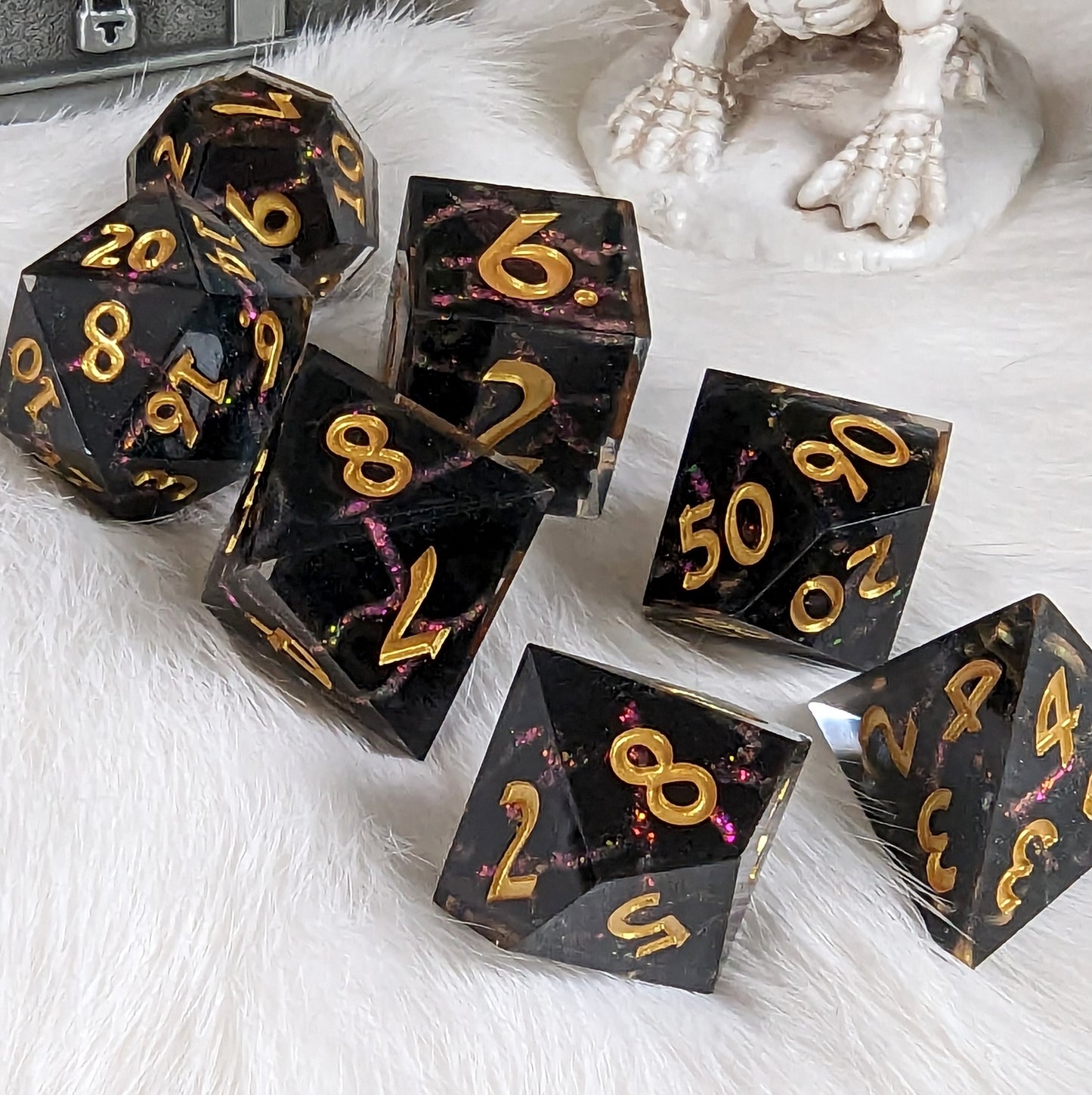 Red Lightning DnD Dice Set with cracked lightning design in black and red resin, featuring sharp edges and glittering numerals.