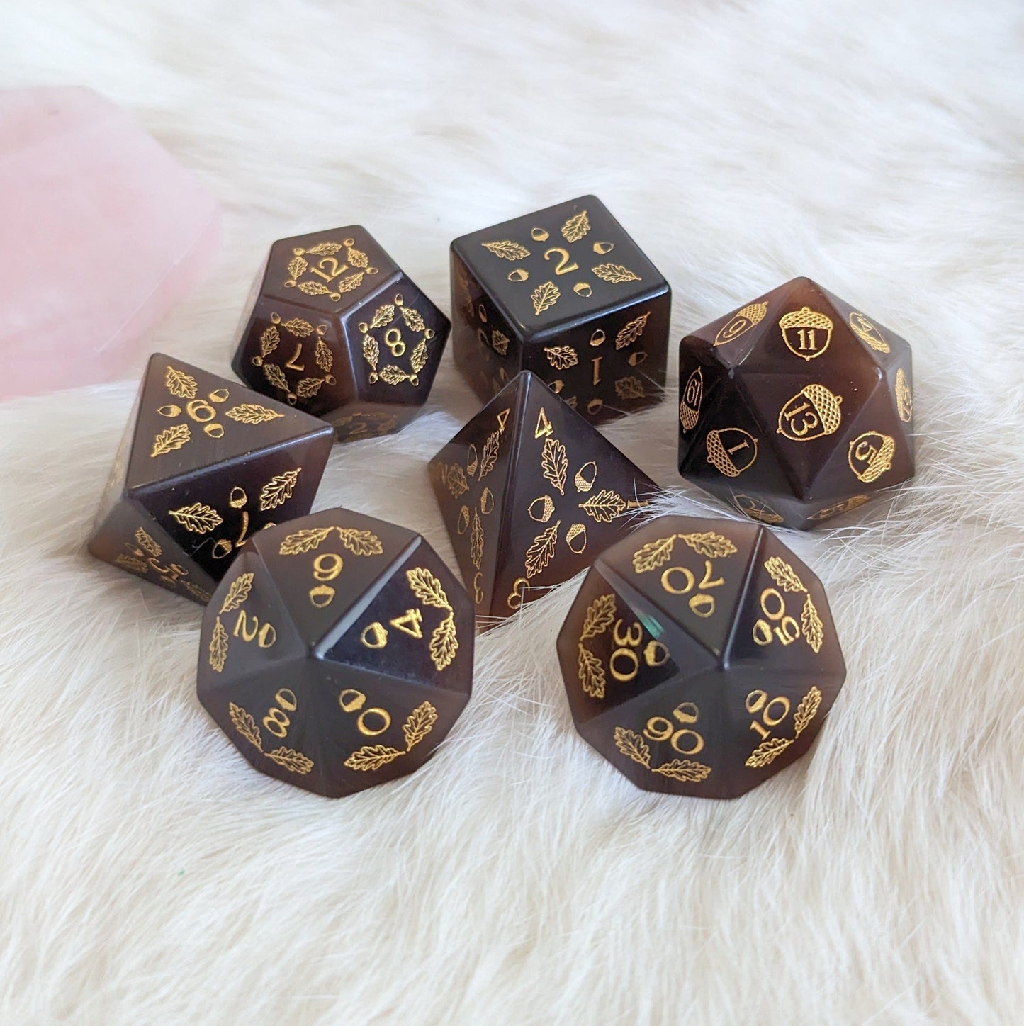 Acorn and Oak Dark Brown Cat's Eye Dice Set featuring carved acorn and oak leaf designs, perfect for tabletop gaming.