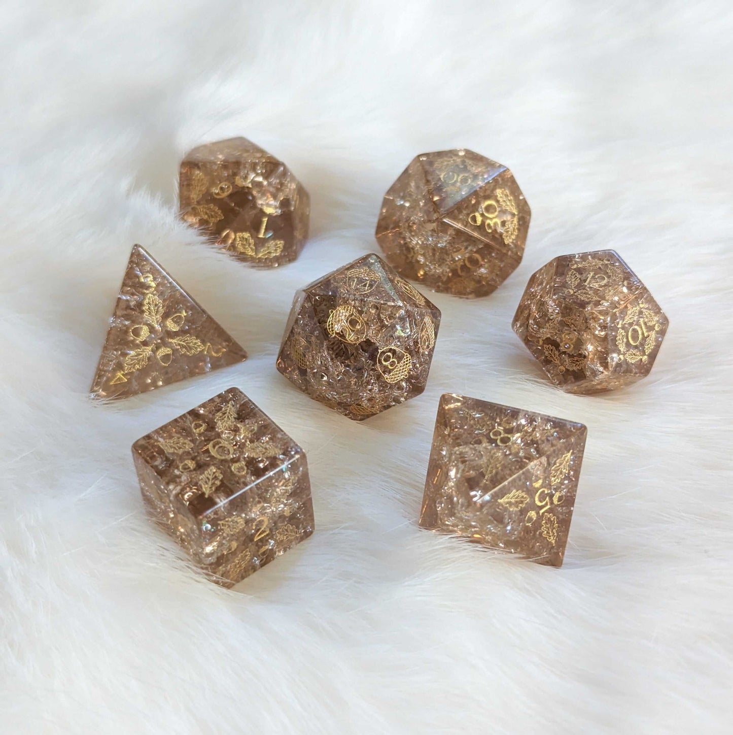 Acorn and Oak Brown Lightning Glass Dice Set with acorn design on a soft white background, includes d20, d12, d10, d%, d8, d6, d4.