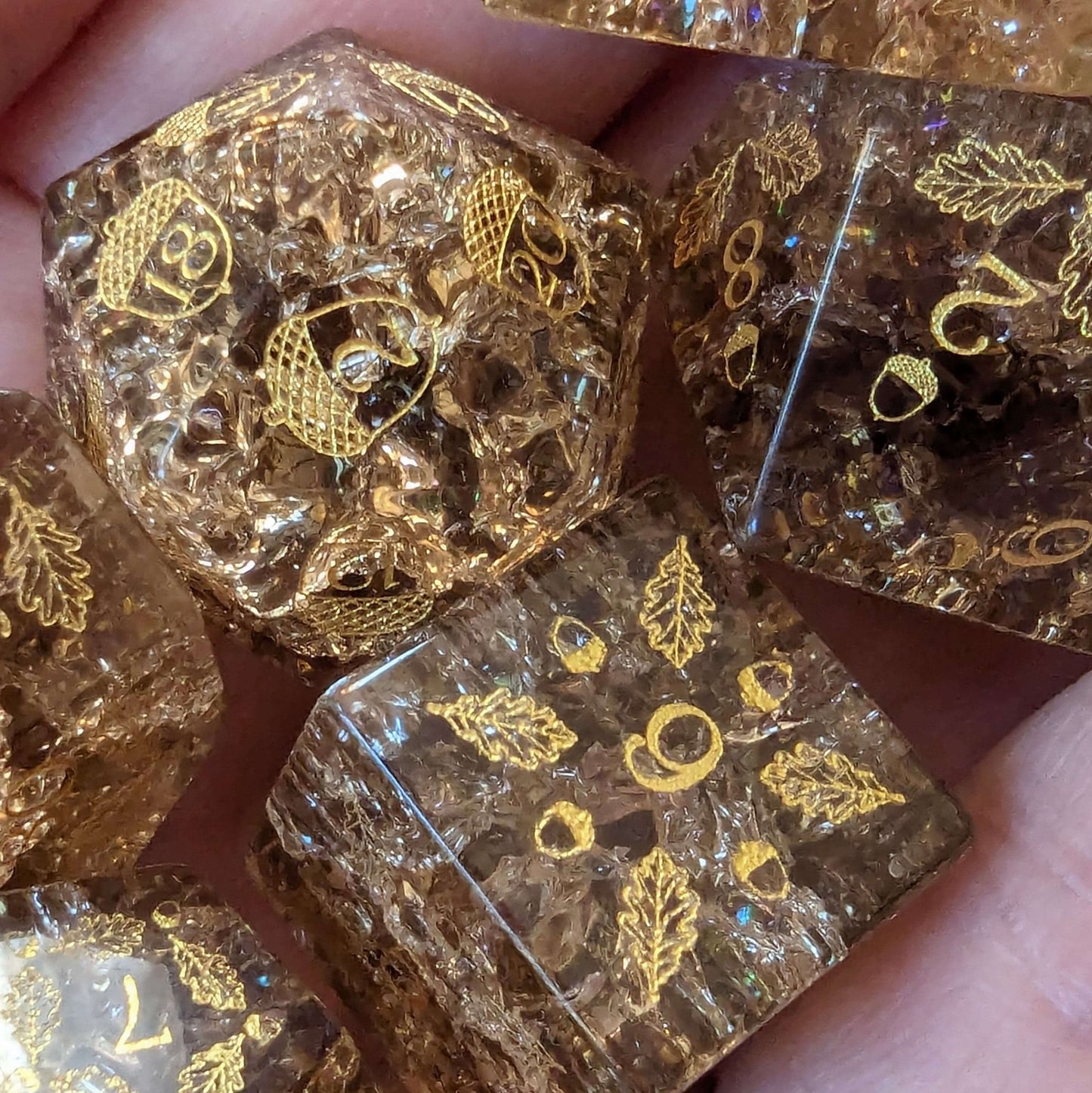 Acorn and Oak Brown Lightning Glass Dice Set with intricate designs of acorns and oak leaves for tabletop games.