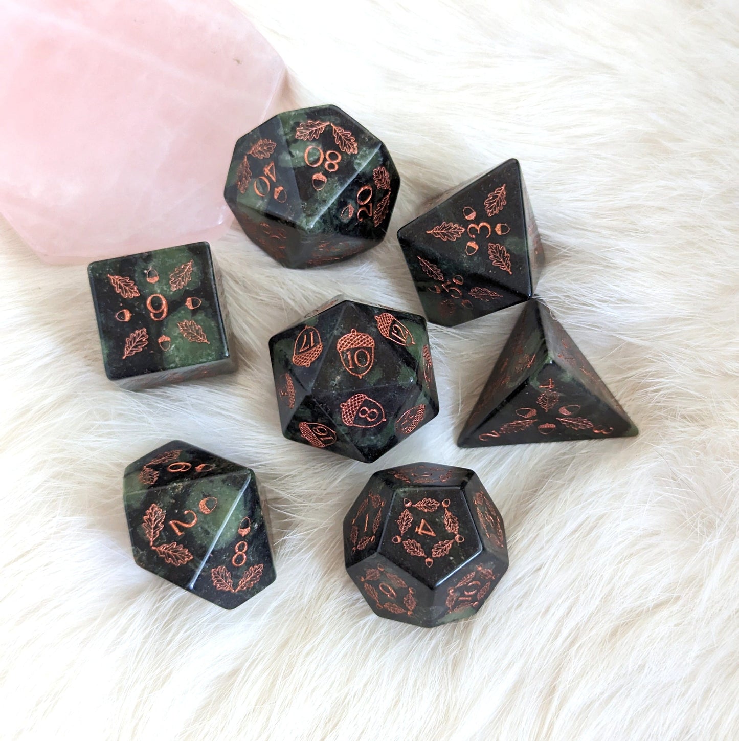 Acorn and Oak Jasper Gemstone Dice Set with carved acorn and oak leaf design on a soft white background.