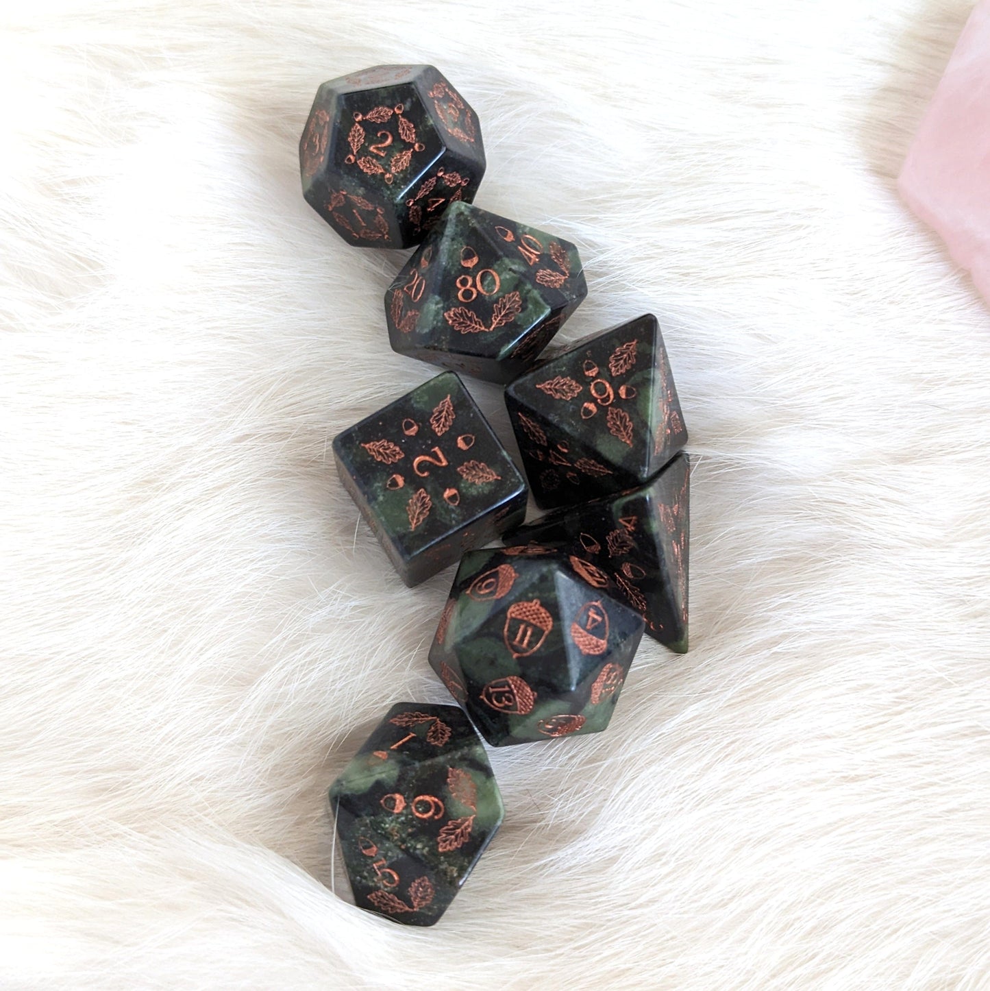 Acorn and Oak Jasper Gemstone Dice Set with carved acorn and oak leaf designs, displayed on a soft white background.