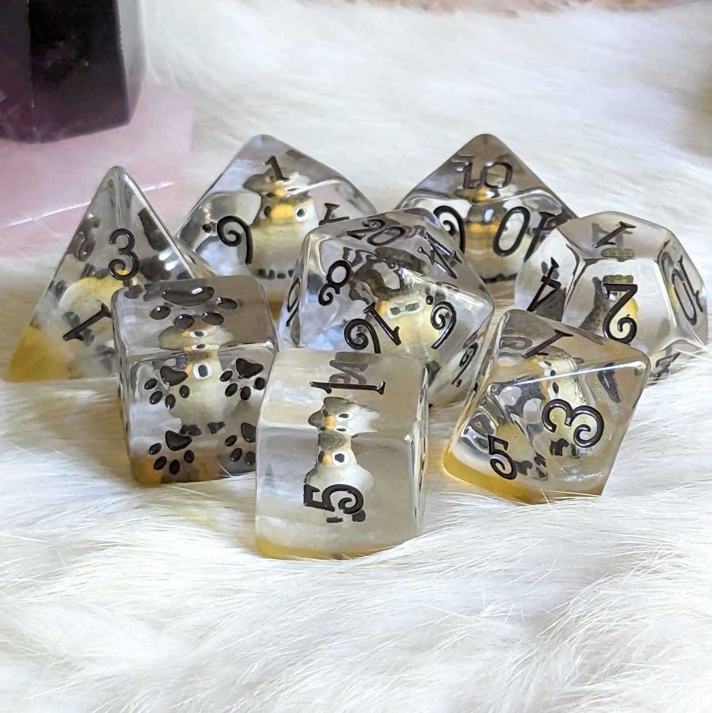 Barn Owl Dice Set with miniature owl figures, 8-piece polyhedral set for TTRPGs, clear resin with custom font and paw counters.