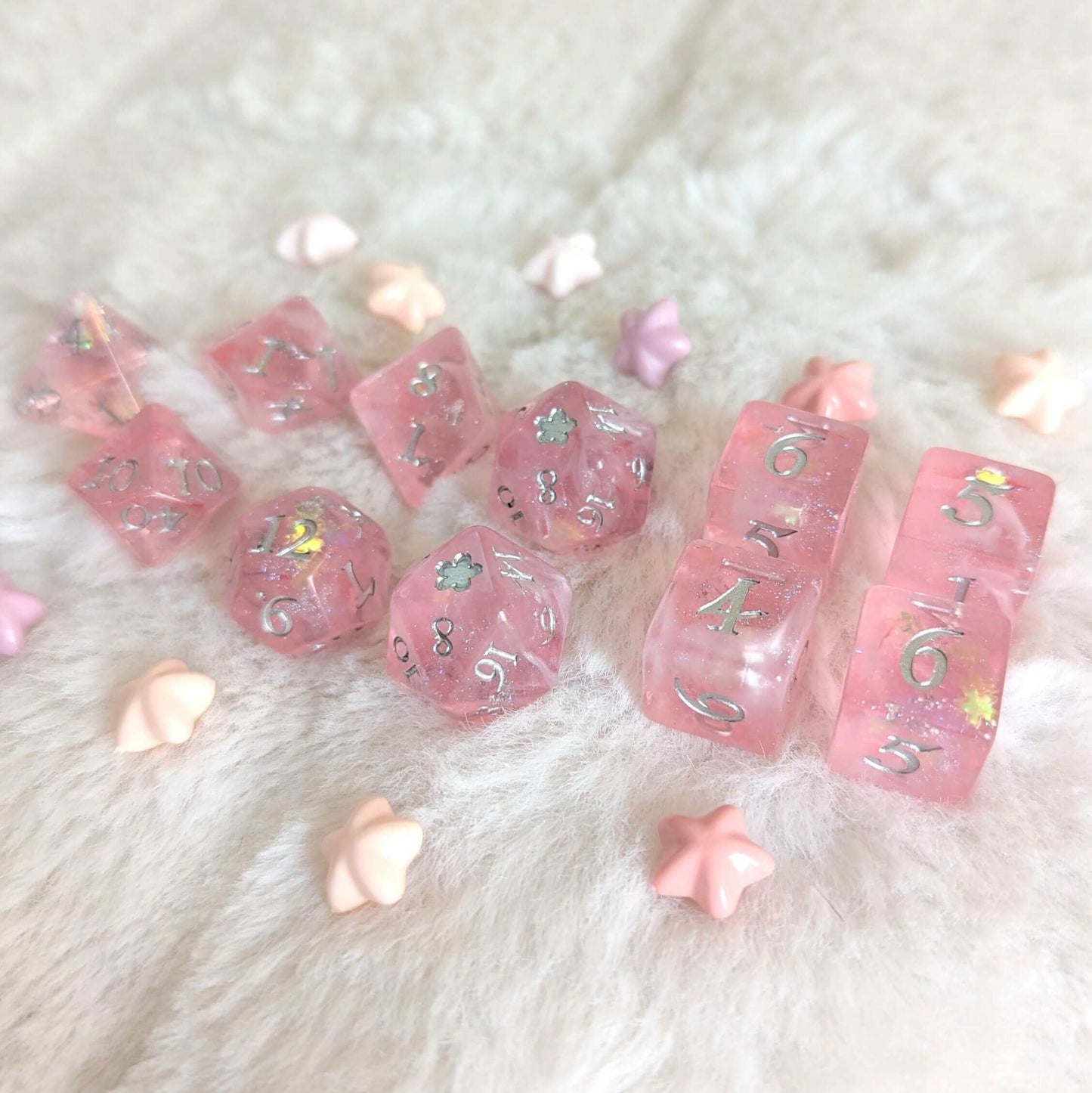 Cherry Blossom Dice Set with pink hues, silver foil numbers, and floral glitter, perfect for TTRPG enthusiasts.
