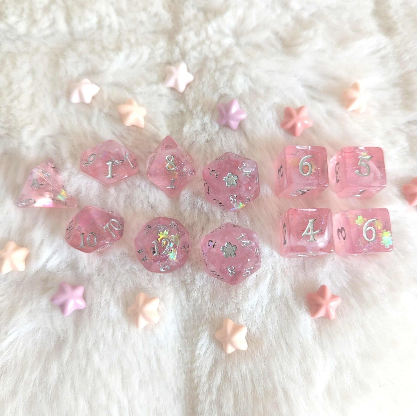 Cherry Blossom Dice Set in light pink with silver foil, cherry blossom glitter, and wispy clouds, displayed on a soft fabric.