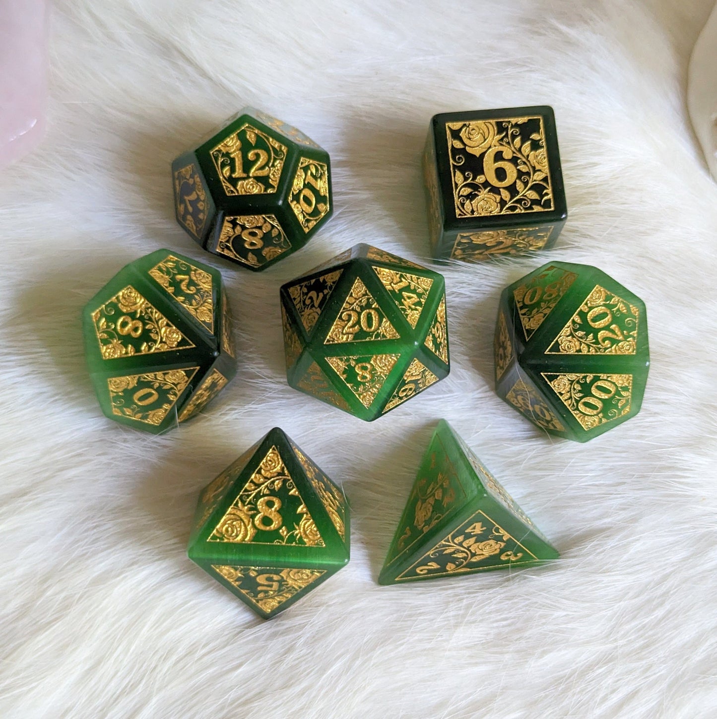Green Cats Eye Rose Dice Set with gold roses and vines design, perfect for Dungeons & Dragons enthusiasts.