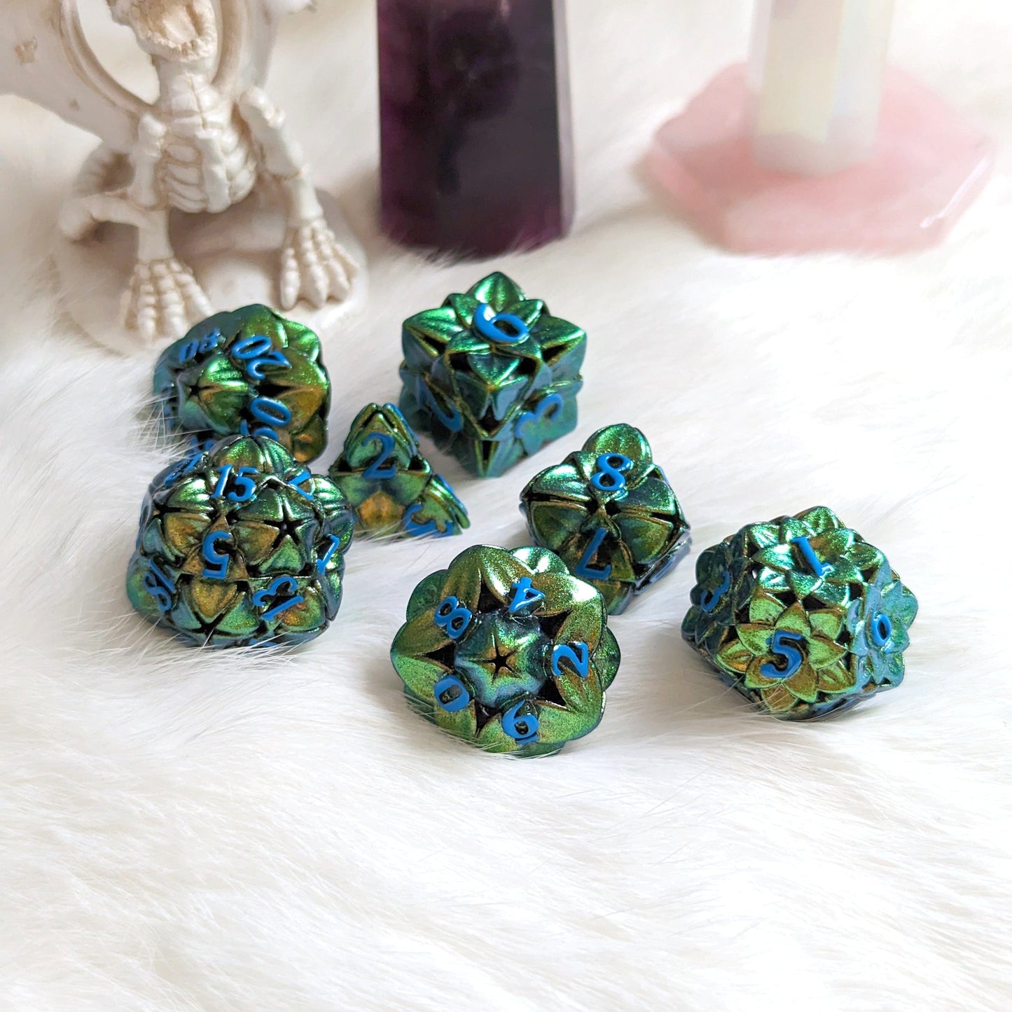 Green Floral Hollow Metal Dice Set with a color-shifting floral design, perfect for tabletop RPGs like Dungeons and Dragons.