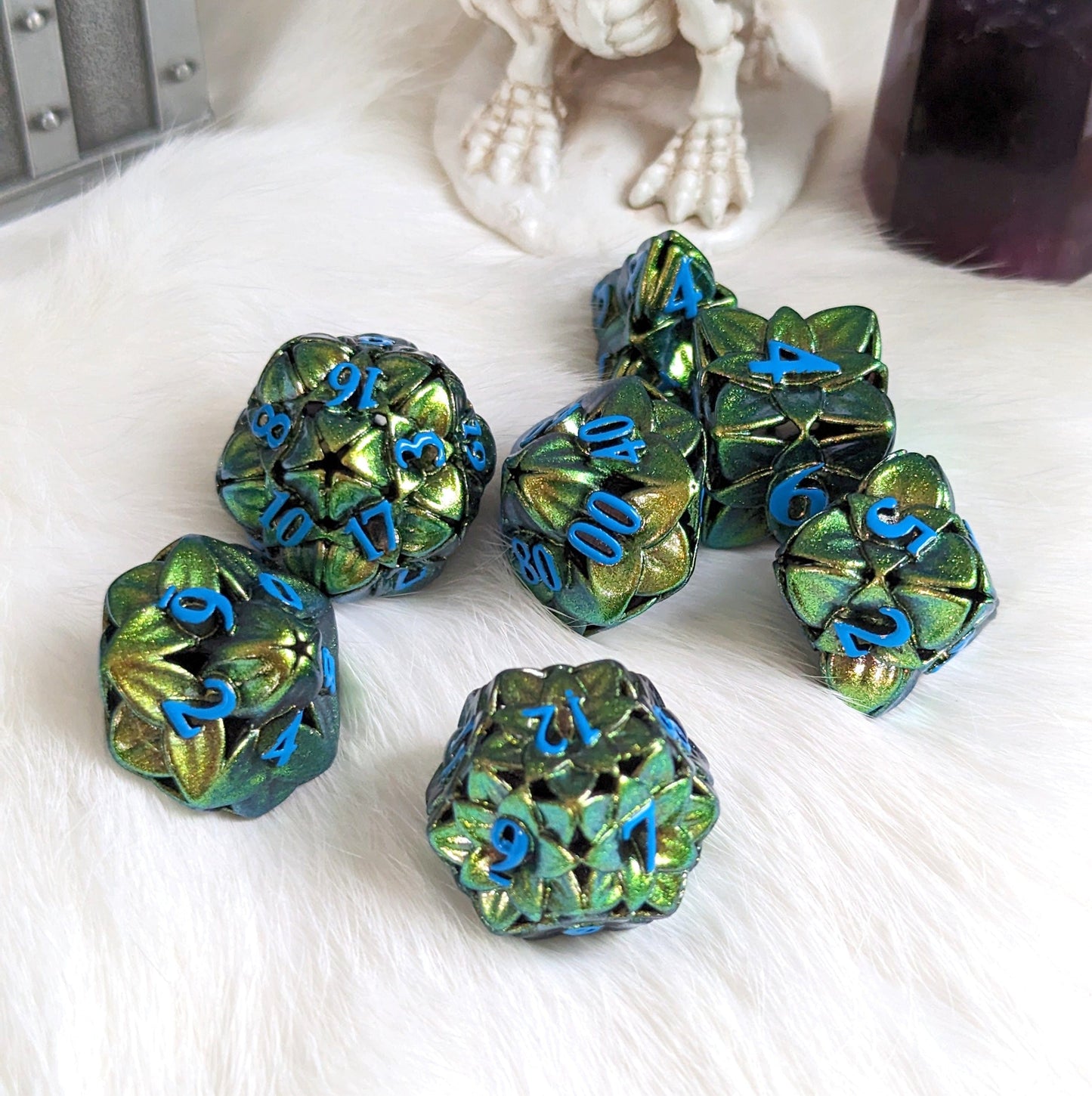 Green Floral Hollow Metal Dice Set with floral 3D designs, ideal for Dungeons and Dragons tabletop games.