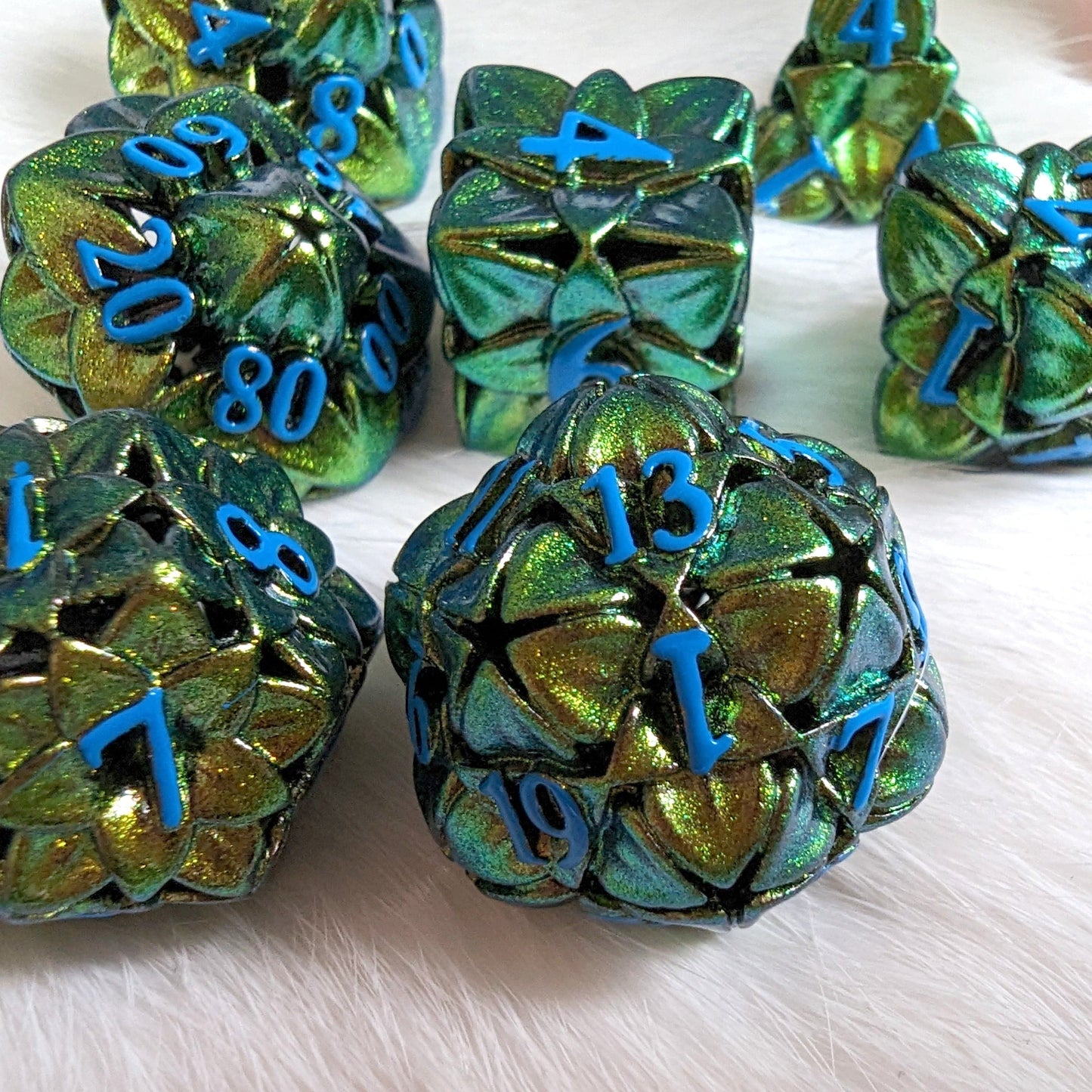 Green Floral Hollow Metal Dice Set with 3D flower design for tabletop games like Dungeons and Dragons.