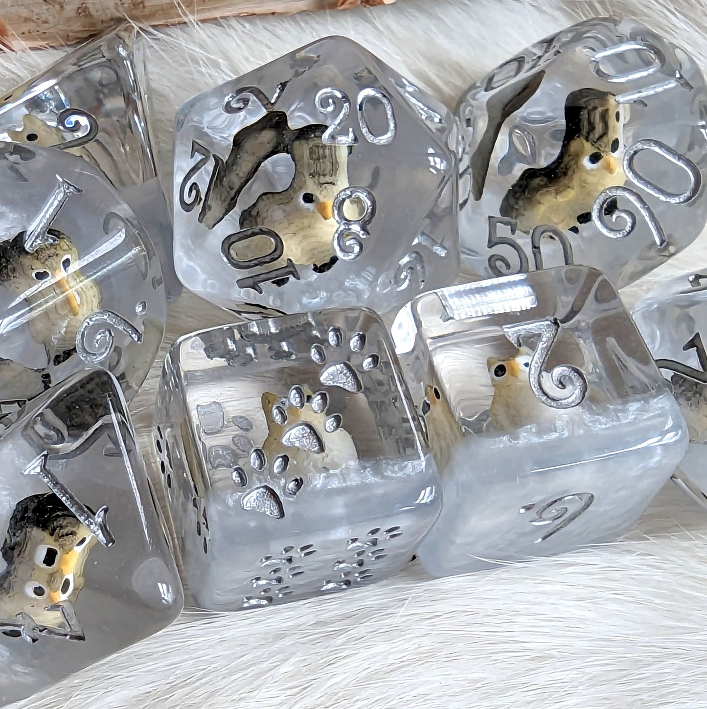 Horned Owl Dice Set with miniature owl figures in clear resin, featuring silver and blue accents and custom font.