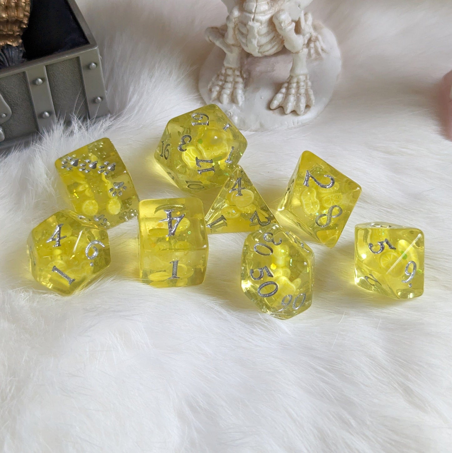 Lemon 8-Piece DnD Dice Set with Glitter and Paw Prints on Furry Surface