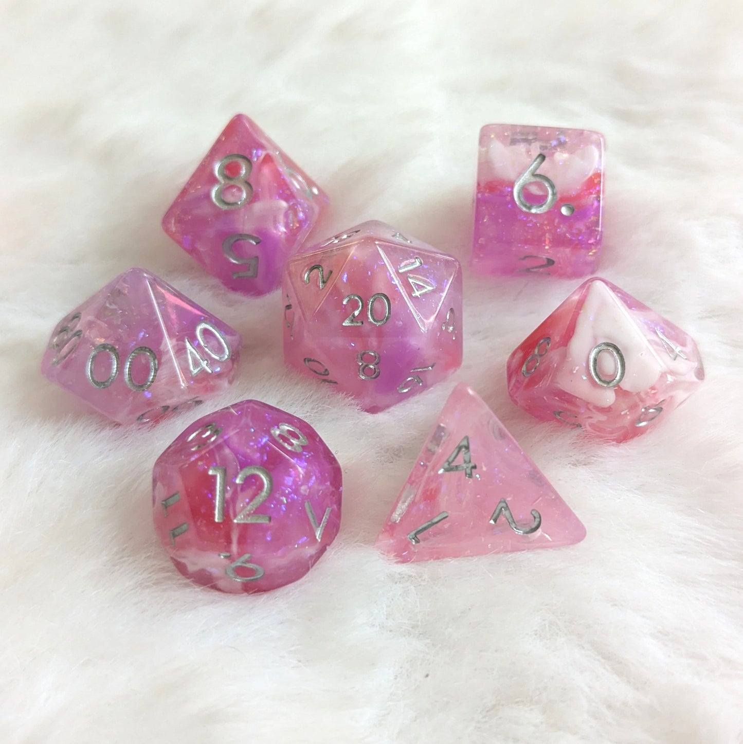 Lover's Enchantment Dice Set with glittering purple, pink, and red hues for tabletop games like Dungeons and Dragons.