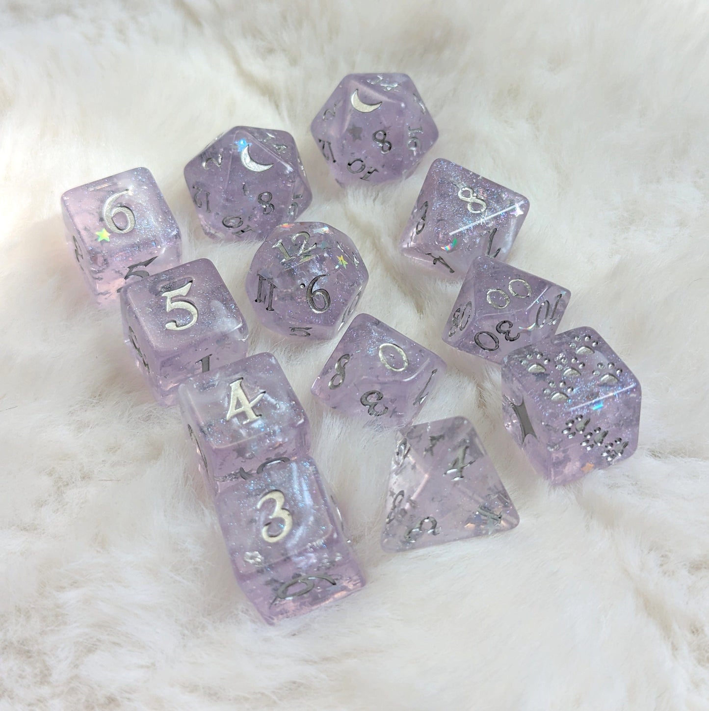 Moonbeam Dice Set with light purple hue, silver foil, star glitter, and crescent moon design on D20 for TTRPG games.