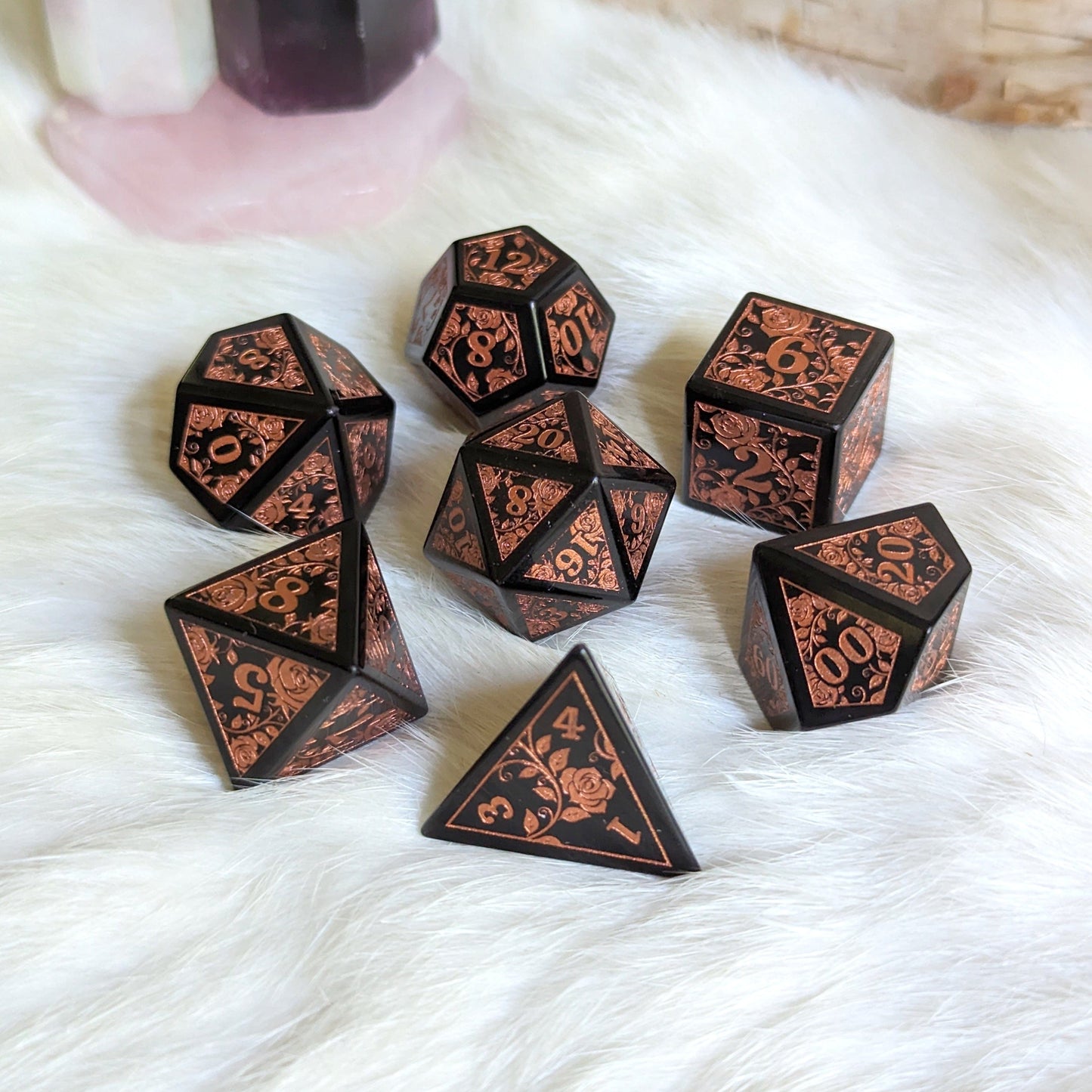 Obsidian Rose Dice Set with copper rose and vine engravings on volcanic glass, ideal for enhancing your Dungeons & Dragons experience.