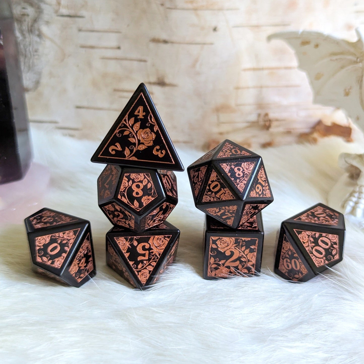 Obsidian Rose Dice Set with copper rose and vine designs on volcanic obsidian glass, perfect for Dungeons & Dragons.