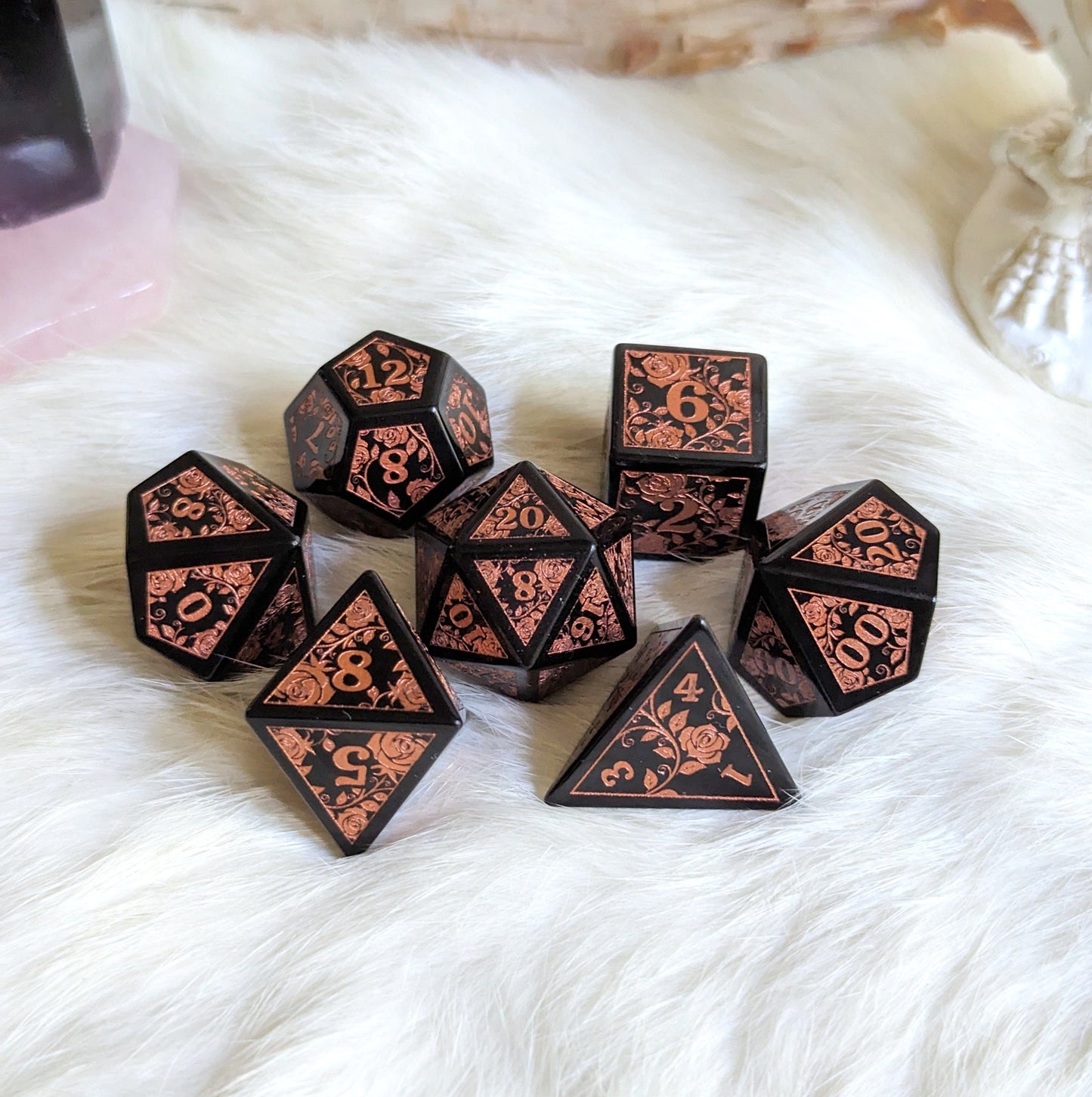 Obsidian Rose Dice Set with copper rose and vine designs on volcanic glass, perfect for Dungeons & Dragons.