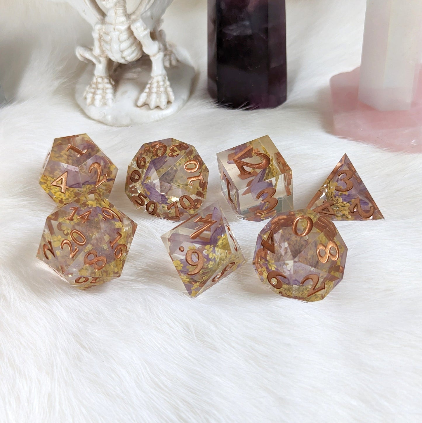 Purple Butterfly and Yellow Flower DnD Dice Set with Copper Font on White Fur Background