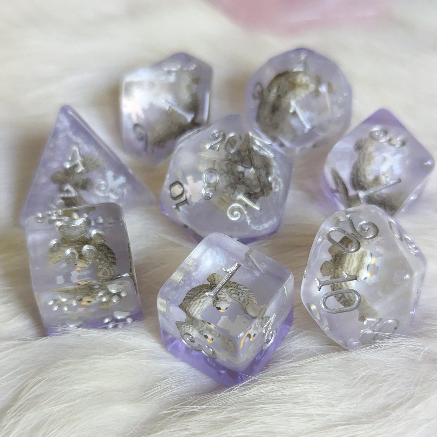 Snowy Owl Dice Set, 8-piece polyhedral dice with miniature owls in clear resin, silver and purple design, perfect for Dungeons and Dragons.