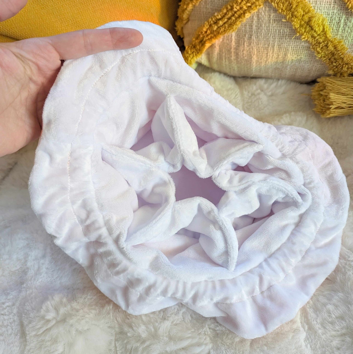 Interior view of starry pink multi-pocket dice bag with soft white velvet fabric and ample storage space.