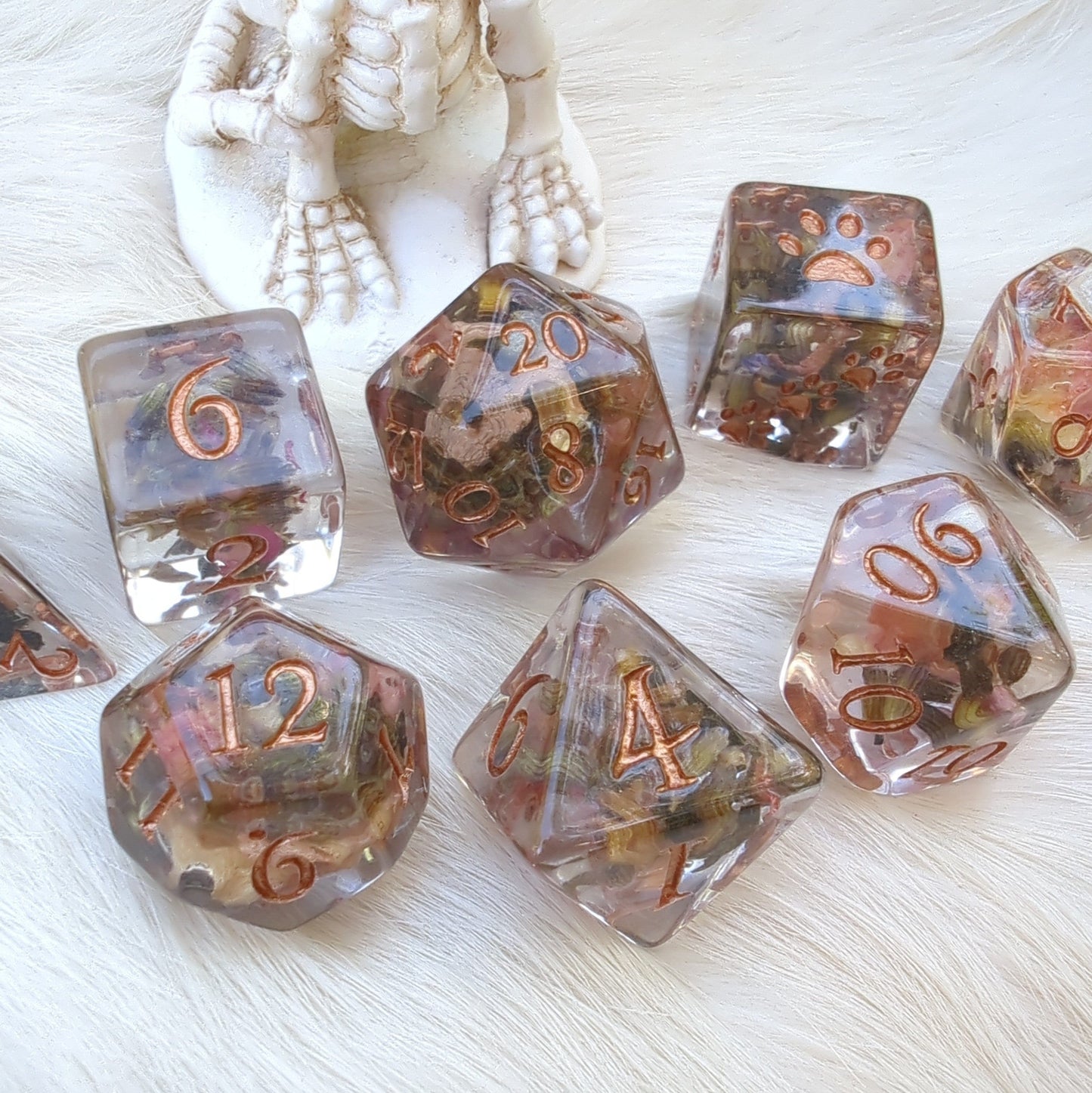 Rose petal and lavender dice set, 8-piece polyhedral with bronze font, designed for D&D, featuring paw counters and no logo on D20.