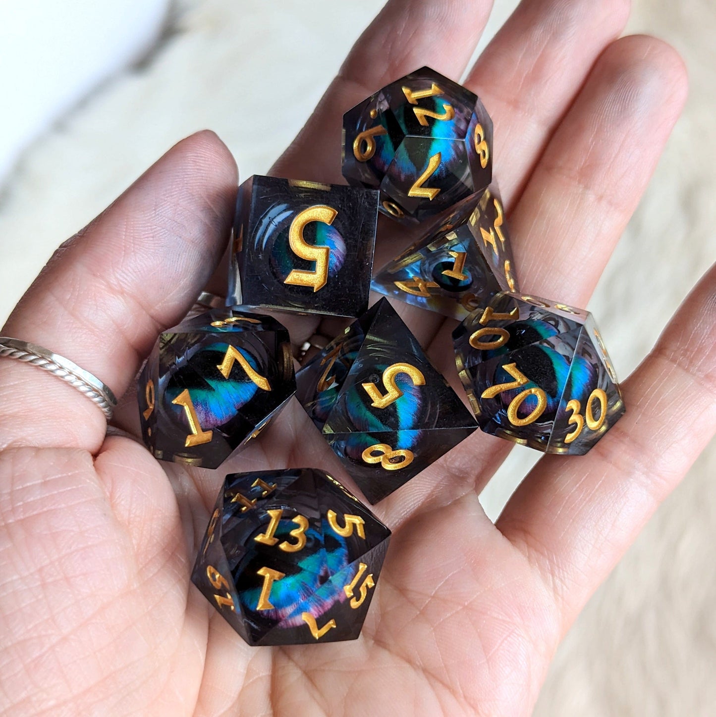 Teal Moving Eye Liquid Core Sharp Edge Resin DnD Dice Set