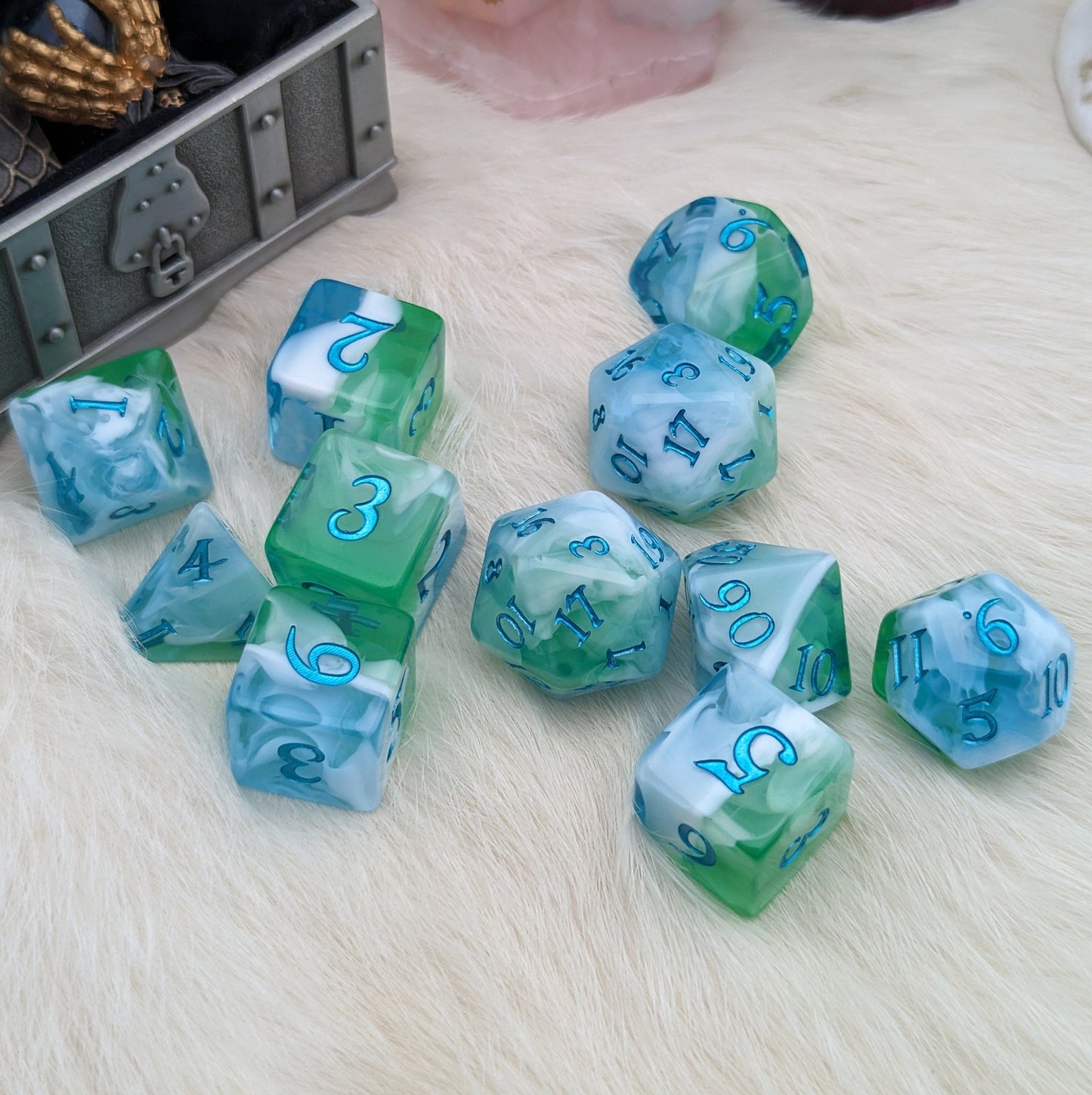 Tidecaller Dice Set with light blue, white, and green hues, featuring metallic teal numbers for TTRPG adventure.