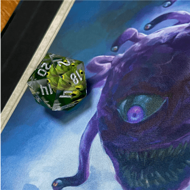 Large sharp edge D20 dice with a beholder design on purple background, unique tabletop gaming accessory.