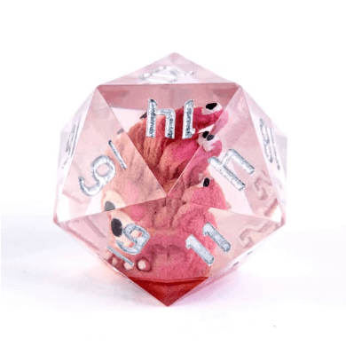Pink D20 dice with sharp edges and silver numbers, featuring a miniature beholder creature inside.