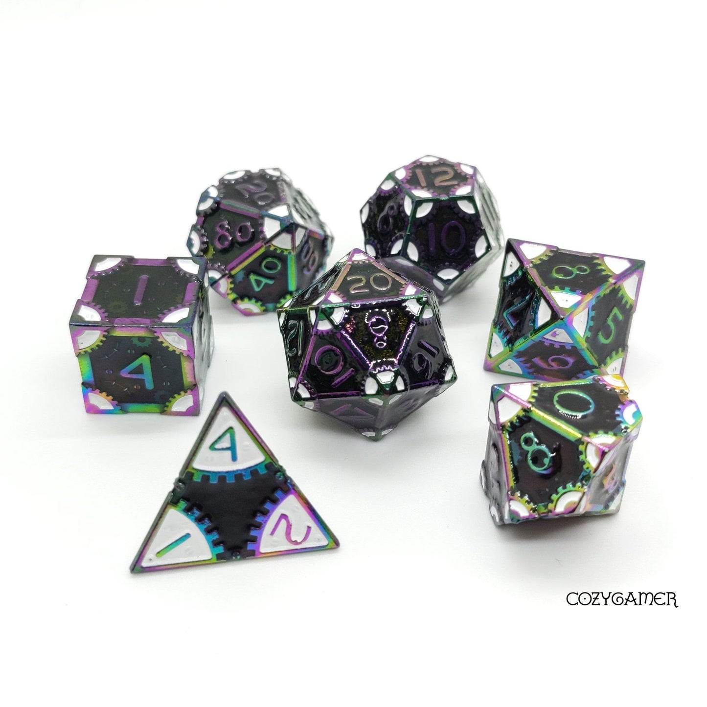 Black and white gear metal dice set with rainbow trim for tabletop RPGs like Dungeons and Dragons, includes seven polyhedral dice.