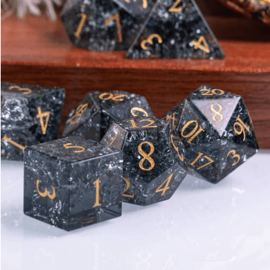 Black Crackled Glass Dice Set with etched numbers, real gemstone TTRPG dice displayed on a surface, perfect for tabletop games.