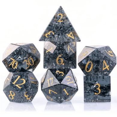 Black crackled glass dice set with gold numbers, seven-piece TTRPG. Real gemstone etched glass dice for tabletop role-playing games.