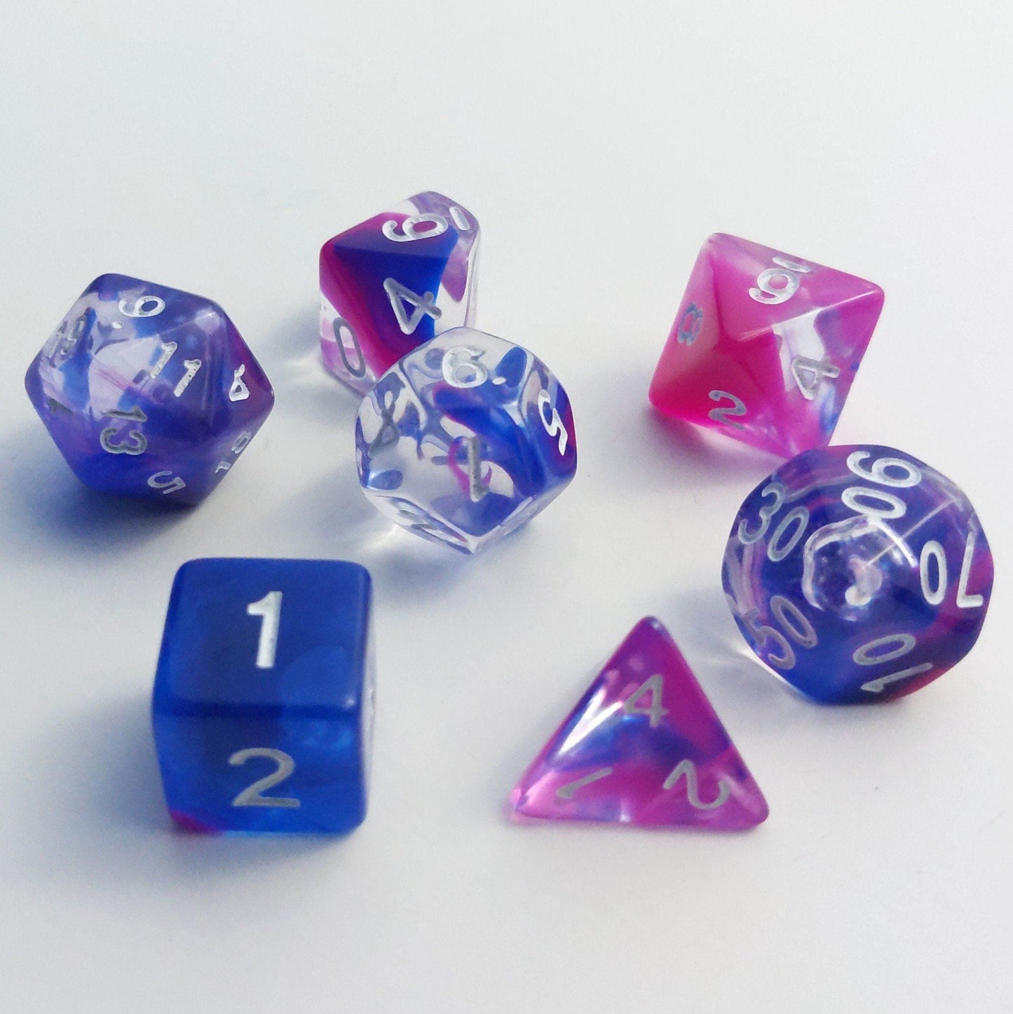 Blink Marble Dice Set with blue and pink swirls, 7-piece polyhedral dice for TTRPGs like Dungeons and Dragons.