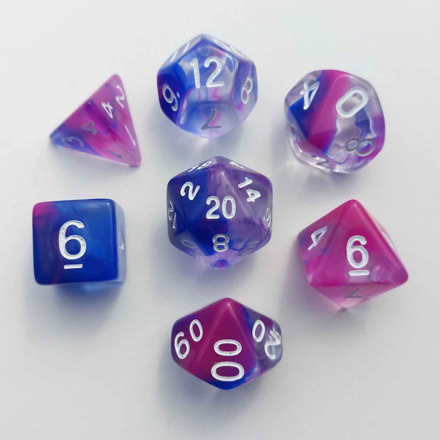 Blink Marble Dice Set with blue and pink acrylic swirls for TTRPGs like Dungeons and Dragons, includes D20 to D4 dice.