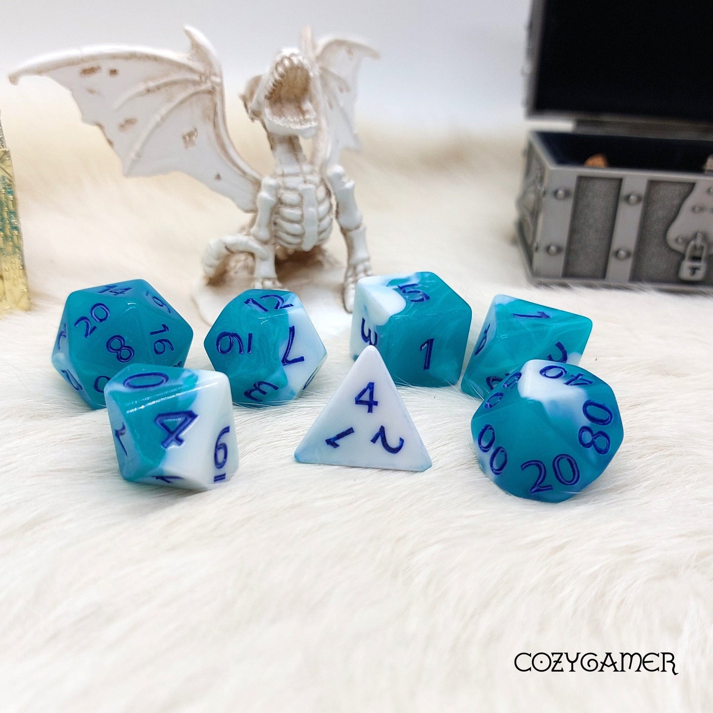 Blue Ocean DnD Dice Set with marbled acrylic design featuring a dragon and treasure chest backdrop, perfect for tabletop RPGs.
