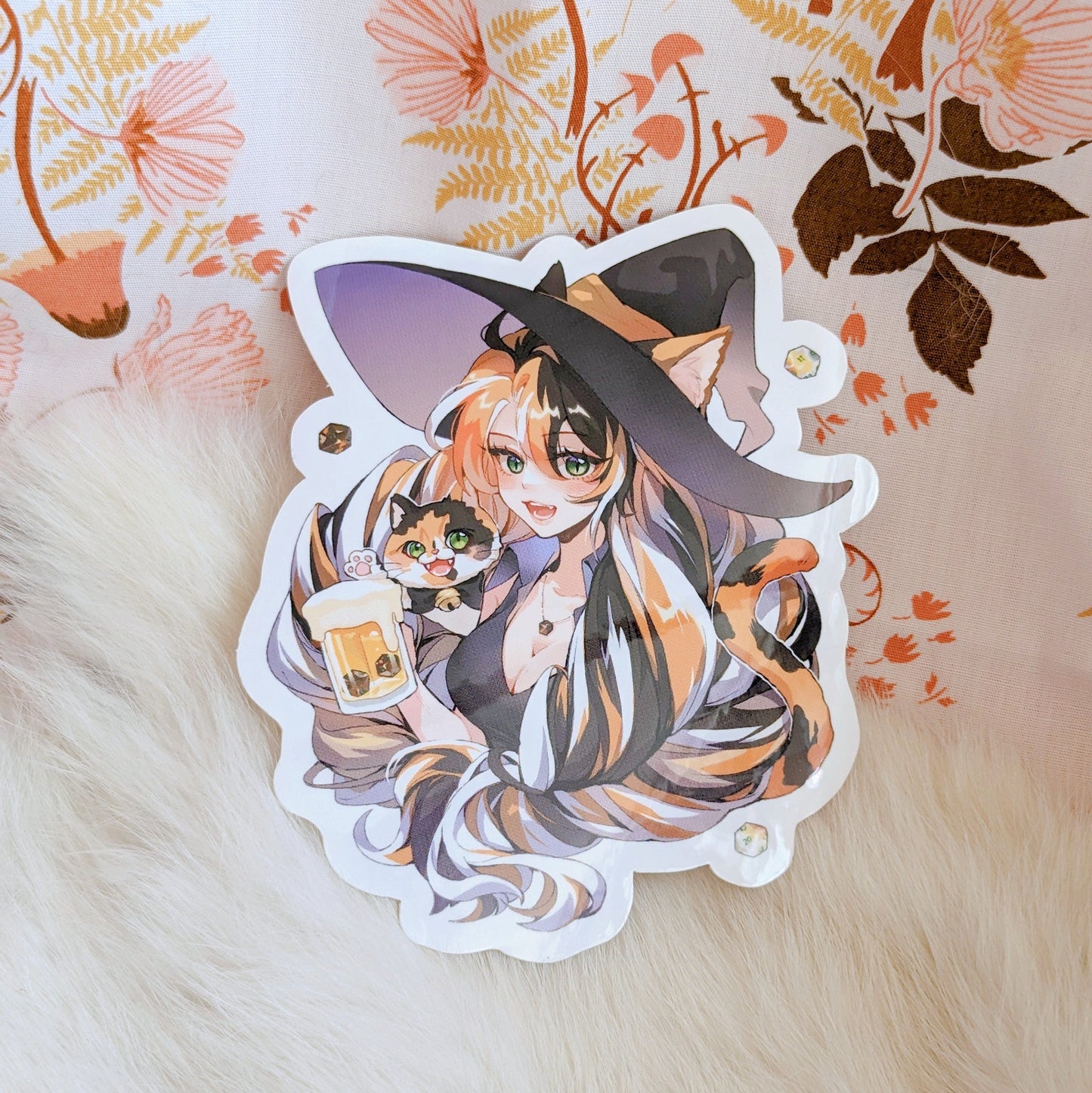 Calico Cat Witch Brewster Sticker on floral and fur background, featuring a witch holding a mug and a cat.