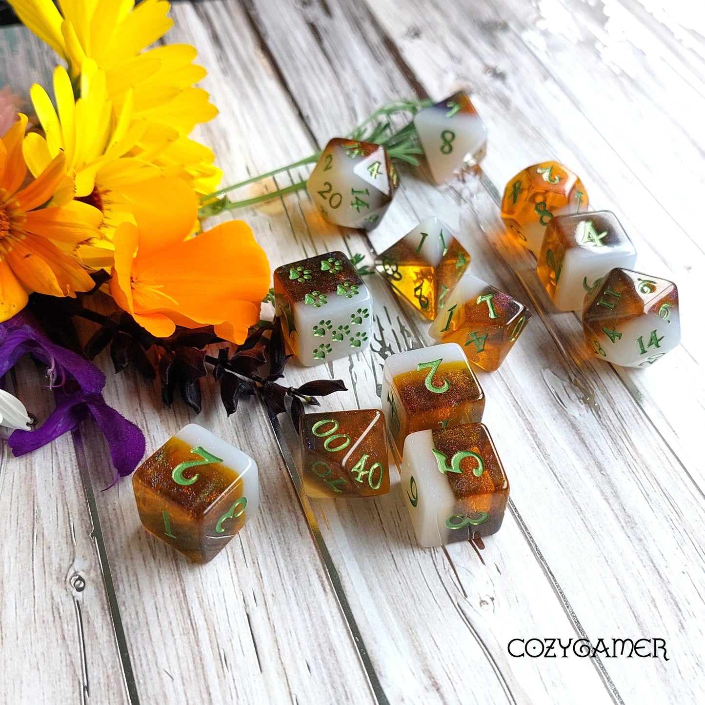 Calico Hazy IPA beer-themed DND dice set with floral background, featuring 12-piece and 8-piece calico cat color dice.