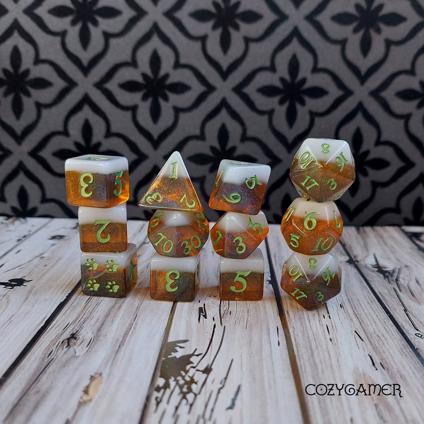 Beer themed Calico Hazy IPA DND dice set with cat paw design, including D6, D20, D12, and more on a patterned background.