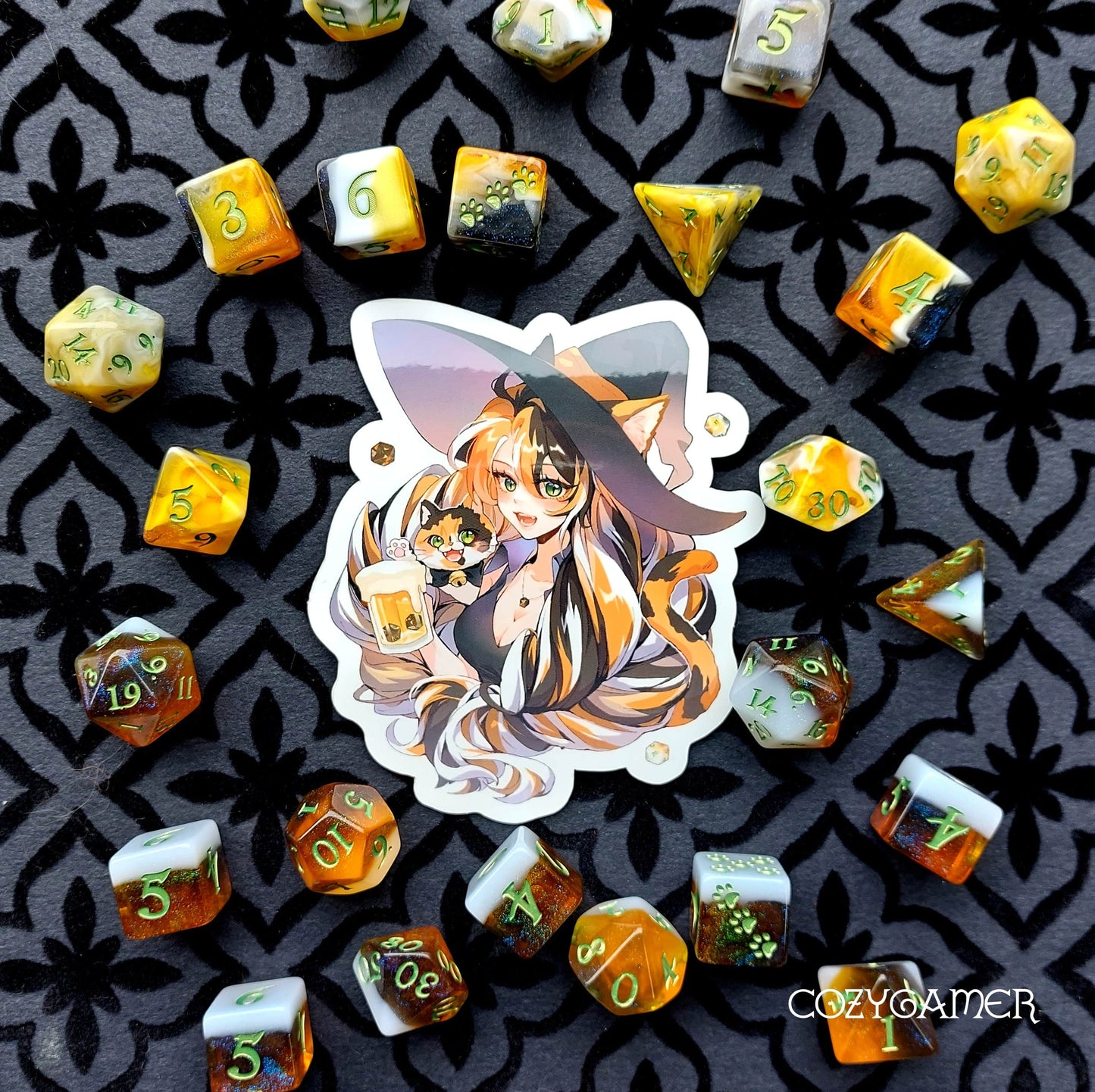 Calico Hazy IPA Dice Set with beer-themed DND dice and anime sticker, displayed on patterned background. CozyGamer branding.