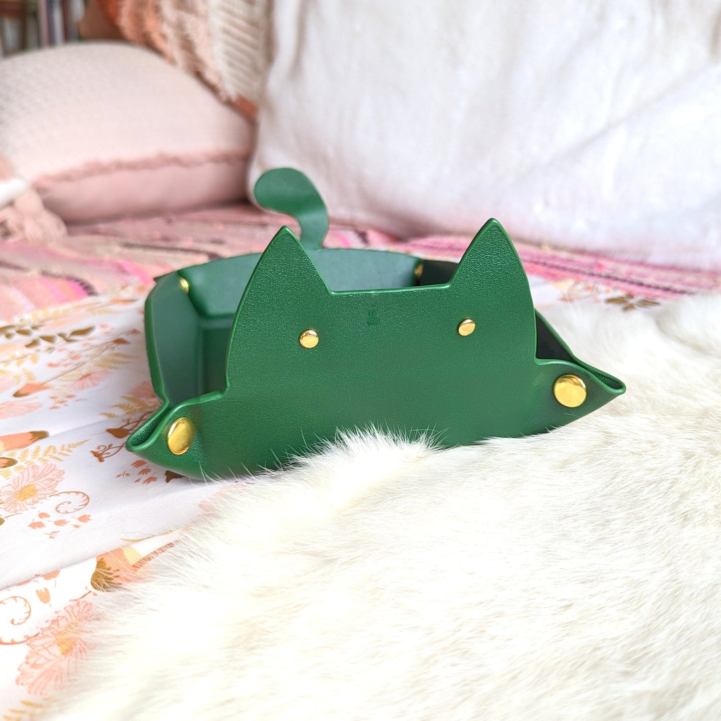 Emerald green cat shaped dice rolling tray on soft surface, perfect for Dungeons and Dragons enthusiasts.