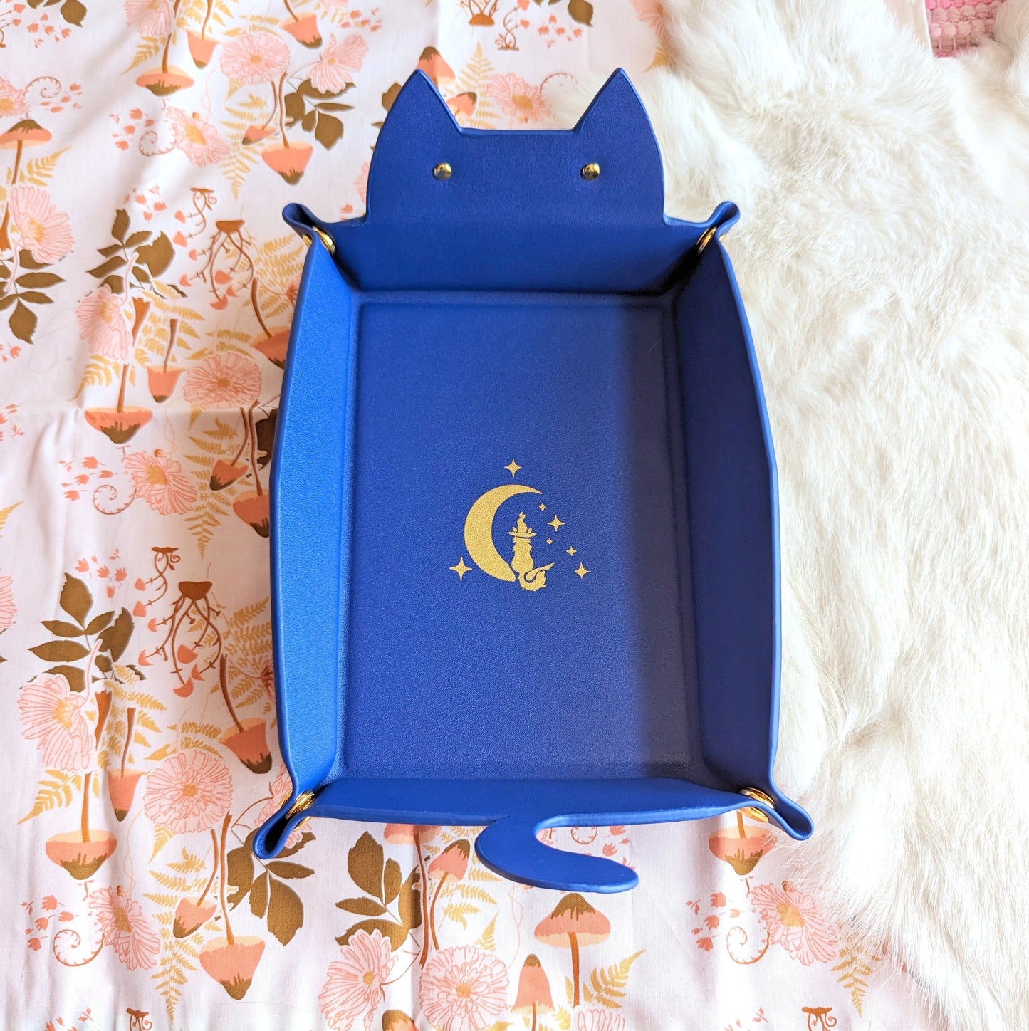 Indigo cat-shaped dice rolling tray for Dungeons and Dragons, featuring a moon and star design, ideal for tabletop gaming.