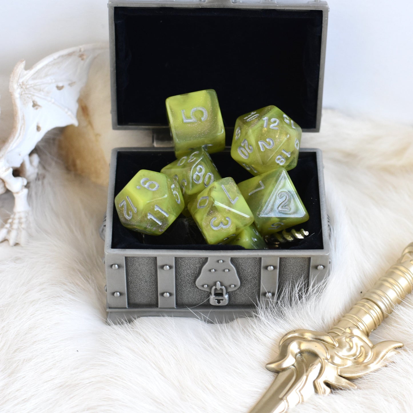 Cave Slime Dice Set with shimmering green polyhedral dice in a treasure chest, perfect for TTRPGs like Dungeons and Dragons.