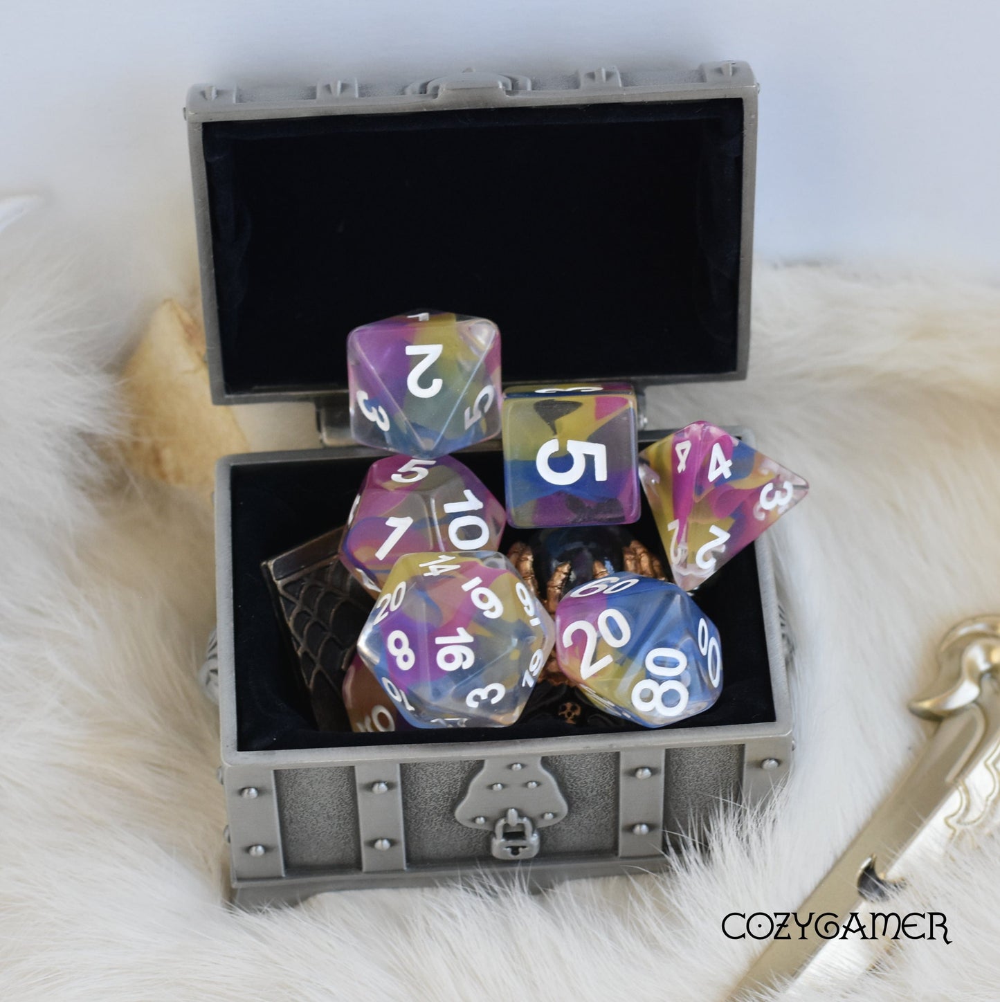 Color Spray Dice Set in silver chest, clear resin with colorful shavings, 7 piece polyhedral dice for tabletop role-playing games.