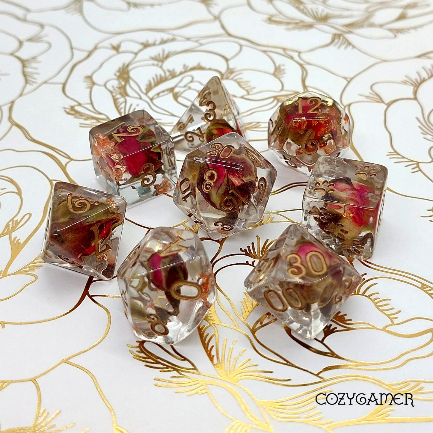 Copper and Rose Buds Dice Set with real dried roses and bronze font on floral background, featuring 8-piece DND dice.