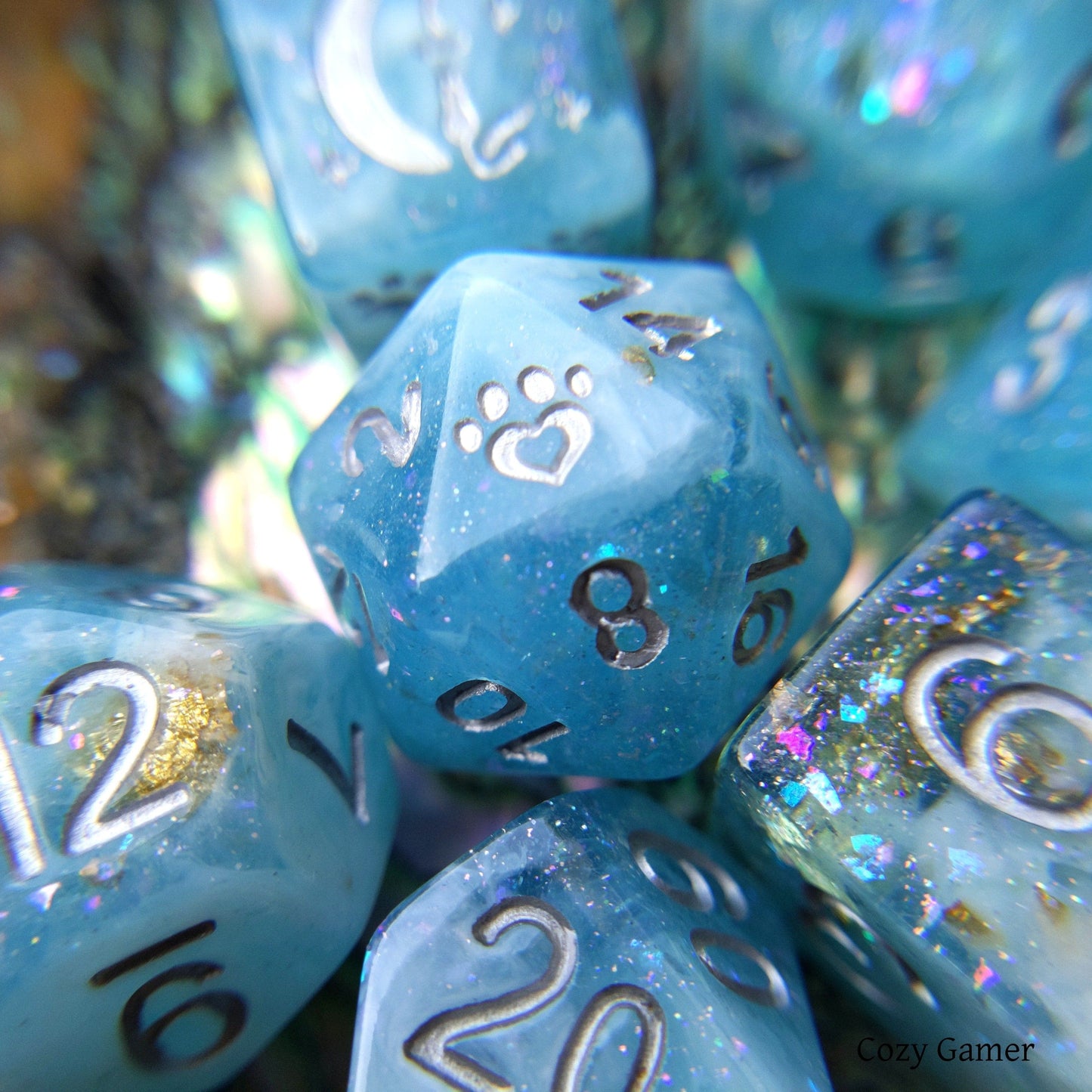 Cresting Wave DnD Dice Set in clear blue resin with glitter, featuring custom cat wizard and paw designs for tabletop RPGs.