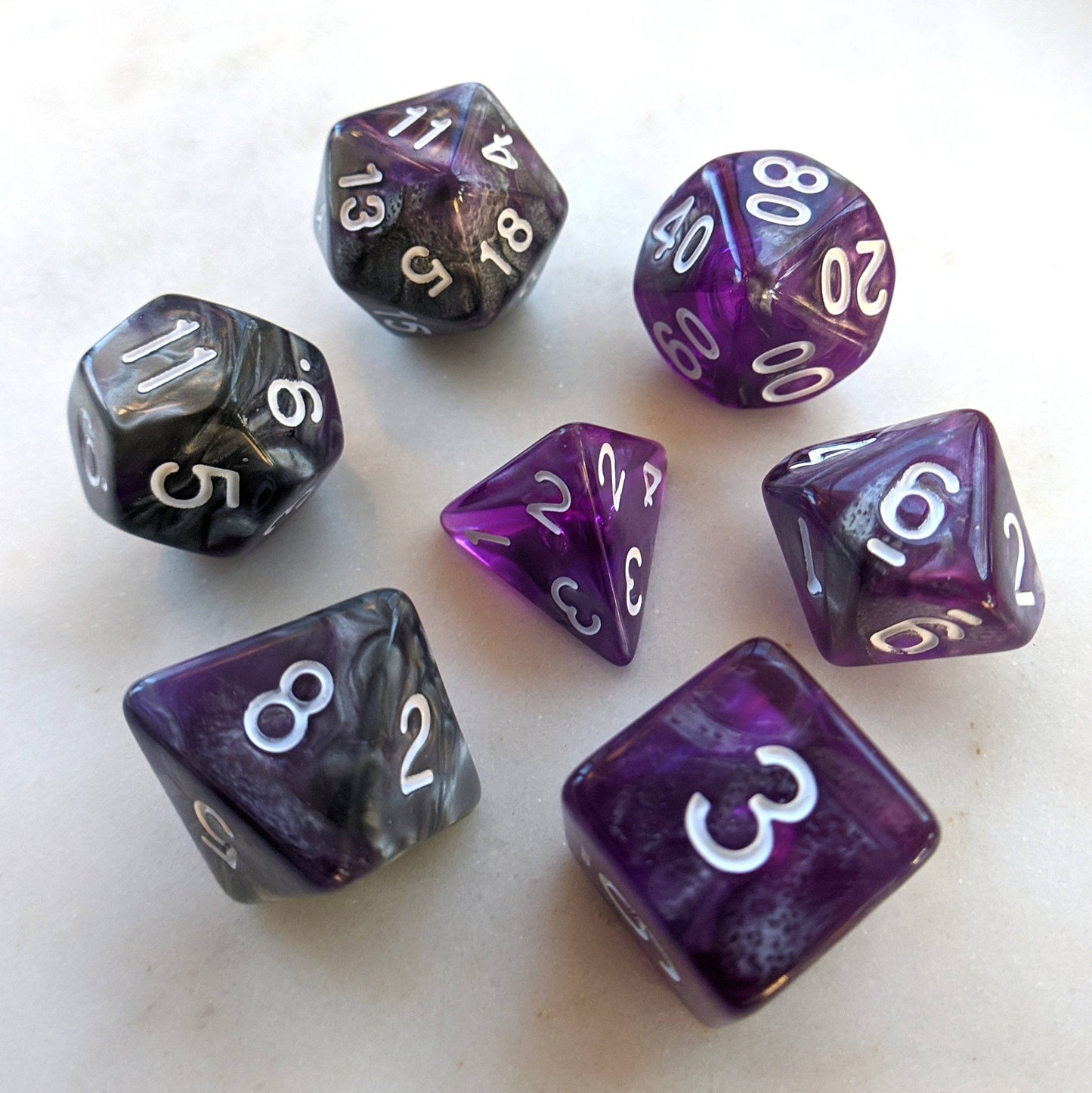 Dark Crystal Dice Set with marbled silver and purple acrylic, perfect for Dungeons and Dragons and tabletop RPGs.