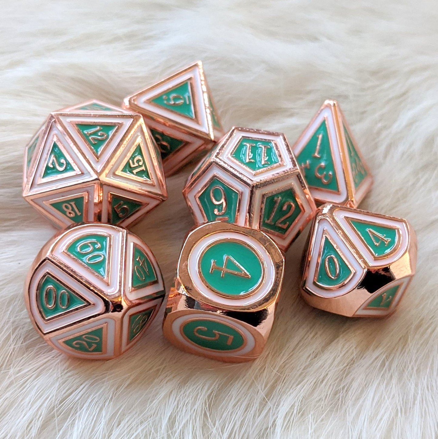 Copper plated green and white enamel Eternal metal dice set, 7-piece polyhedral, ideal for tabletop RPGs like Dungeons and Dragons.