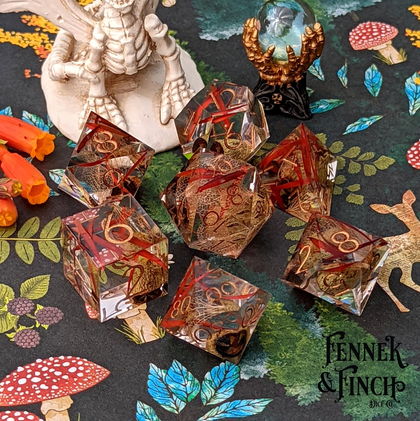 Eucalyptus sharp edge resin dice set with dried plants on a fantasy-themed background, perfect for TTRPG players, by Fennek and Finch.