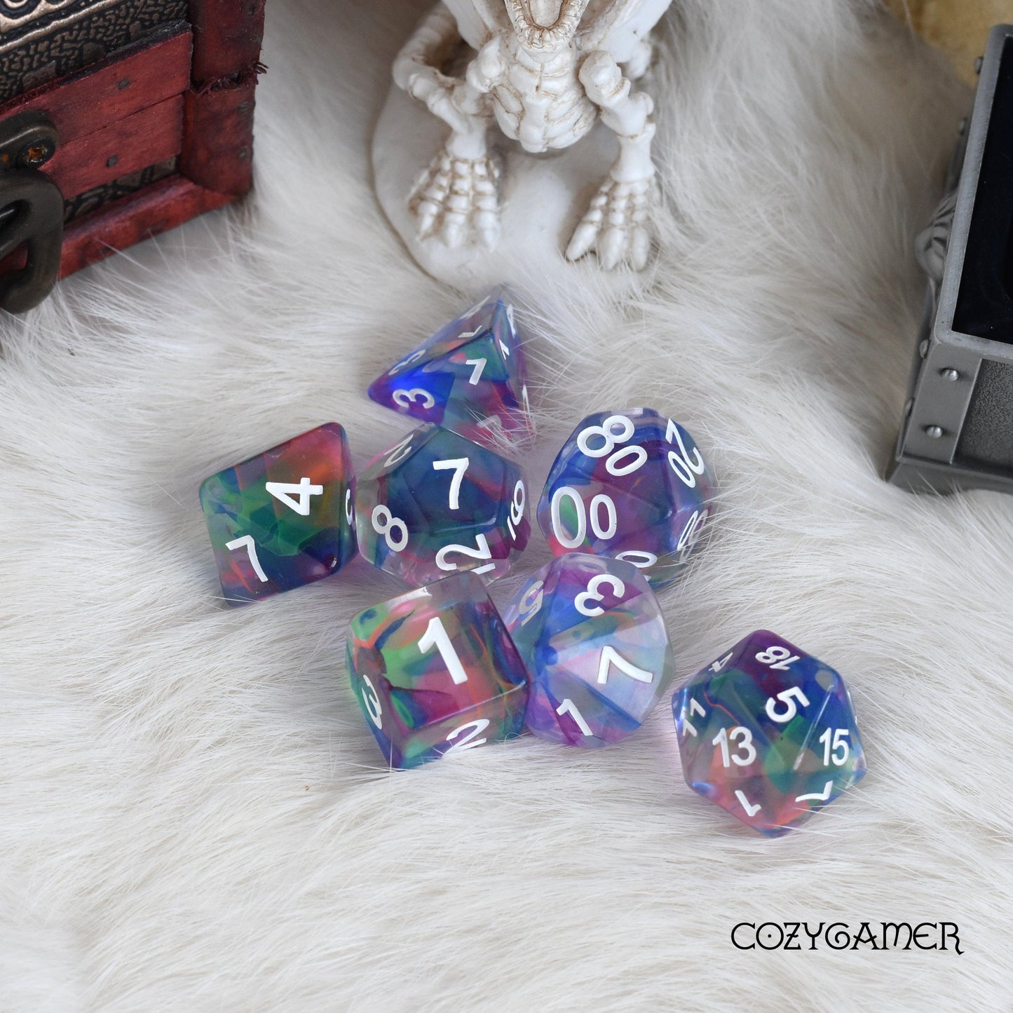 Fairy's Tale Dice Set with colorful shavings on a fluffy surface, perfect for Dungeons and Dragons and tabletop role-playing games.
