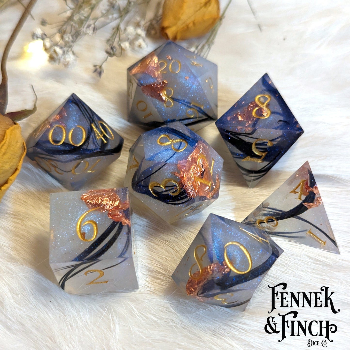 Feather Fall sharp edge dice set with black feathers, copper foil, and misty effect for DnD and tabletop games.